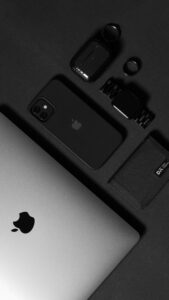 Stylish arrangement of sleek technology products on a dark backdrop, highlighting modern gadgetry.